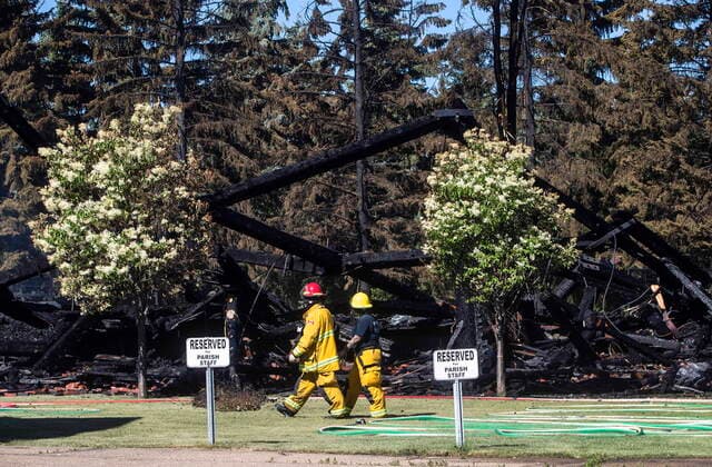 June 30, 2021, Morinville, ab, Canada: Firefighter walk past the remains of a Catholic church that was on fire, in Morinville Alta, on WednesdayJune 30, 2021. Morinville Canada  - ZUMAc35_ 20210630_zaf_c35_002 Copyright: xJasonxFransonx