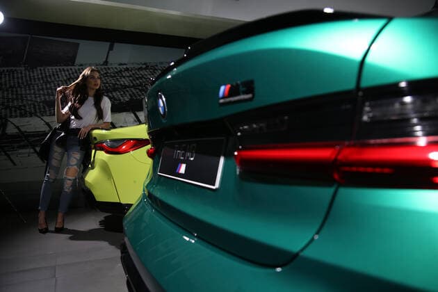 New Bmw M3 And M4 Competition Launch In Jakarta Models pose between The All New BMW M3 and M4 Competition cars after a virtual launch in Jakarta, Indonesia on June 30, 2021. BMW Indonesia launched the two cars with three new colors, a high-performance 510hp 650Nm engine, and an expressive design as well as an eight-speed BMW M Steptronic transmission with Drivelogic and a series of innovative technologies developed by BMW M that will be offered for The new BMW M3 Competition with the price of IDR 2,059 billion off the road, while the New BMW M4 Competition Coupe will be offered at a price of IDR 2.119 billion off the road. Jakarta Indonesia roszandi-notitle210630_npd5r  Copyright: xDasrilxRoszandix