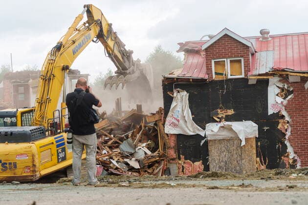 June 30, 2021, sherbrooke, PQ, Canada: A photographer records the demolition of the Hells Angels bunker in Sherbrooke, Que. on Wednesday, June 30, 2021. The bunker was the site of some notorious crimes during the biker war during the mid 1980 s in Quebec. sherbrooke Canada  - ZUMAc35_ 20210630_zaf_c35_024 Copyright: xPaulxChiassonx