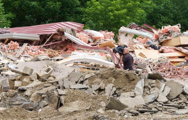 June 30, 2021, sherbrooke, PQ, Canada: A cameraman records the demolition of the Hells Angels bunker in Sherbrooke, Que. on Wednesday, June 30, 2021. The bunker was the site of some notorious crimes during the biker war during the mid 1980 s in Quebec. sherbrooke Canada  - ZUMAc35_ 20210630_zaf_c35_025 Copyright: xPaulxChiassonx