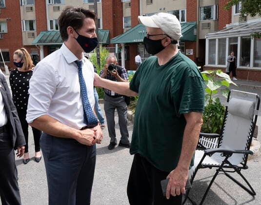 June 30, 2021, Ottawa, on, Canada: Prime Minister Justin Trudeau speaks with a man at the Shepherds of Good Hope residence following an announcement in Ottawa, Wednesday, June 30, 2021. Ottawa Canada  - ZUMAc35_ 20210630_zaf_c35_034 Copyright: xAdrianxWyldx