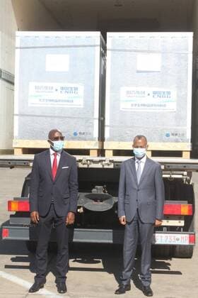 (210630) -- MAPUTO, June 30, 2021 -- Mozambican Minister of Health Armindo Tiago (L) stands in front of containers of the COVID-19 vaccine in Maputo, Mozambique, on June 30, 2021. Mozambique on Wednesday received 500,000 doses of COVID-19 vaccine purchased by the country s private sector in coordination with the government. The procurement of the 500,000 doses of the Sinopharm COVID-19 vaccine, an inactivated vaccine called SARS-CoV-2 Vaccine (Vero Cell), is part of the local initiative United for the vaccine against COVID-19 (UNIVAX), of which, 139,000 doses will be offered to the Mozambican government. (Photo by Xinhua) MOZAMBIQUE-MAPUTO-CHINA-COVID-19 VACCINE-ARRIVAL EdsonxManjate
