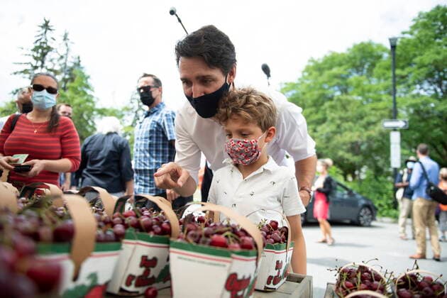 July 1, 2021, Ottawa, on, Canada: Prime Minister Justin Trudeau and his son Hadrien pick out fresh cherries at the Parkdale Public Market in Ottawa on Canada Day, Thursday, July 1, 2021. Ottawa Canada  - ZUMAc35_ 20210701_zaf_c35_022 Copyright: xJustinxTangx