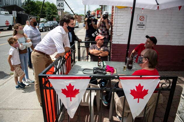 July 1, 2021, Ottawa, on, Canada: Prime Minister Justin Trudeau greets patrons on a pub s patio after shopping with his family at the Parkdale Public Market in Ottawa on Canada Day, Thursday, July 1, 2021. Ottawa Canada  - ZUMAc35_ 20210701_zaf_c35_027 Copyright: xJustinxTangx