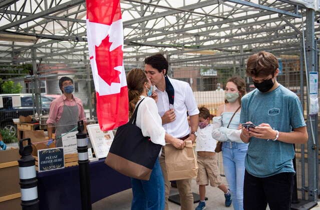 July 1, 2021, Ottawa, on, Canada: Prime Minister Justin Trudeau kisses his wife Sophie Gregoire Trudeau as she prepares to leave before him, after the family went shopping together at the Parkdale Public Market in Ottawa on Canada Day, Thursday, July 1, 2021. Ottawa Canada  - ZUMAc35_ 20210701_zaf_c35_029 Copyright: xJustinxTangx