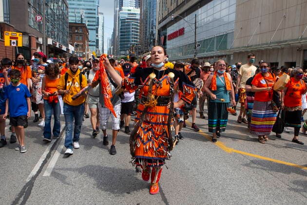 July 1, 2021, Toronto, on, Canada: Danielle Migwans wears a jingle dress as she performs a healing dance during an Every Child Matters walk in Toronto, on Thursday, July 1, 2021, to honour former residential school students. Toronto Canada  - ZUMAc35_ 20210701_zaf_c35_031 Copyright: xChrisxYoungx