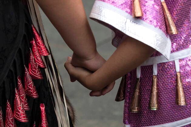 July 1, 2021, Toronto, on, Canada: Two young girls in jingle dresses hold hands during a Cancel Canada Day rally in Toronto, on Thursday, July 1, 2021 to honour former residential school victims. Toronto Canada  - ZUMAc35_ 20210701_zaf_c35_269 Copyright: xChrisxYoungx