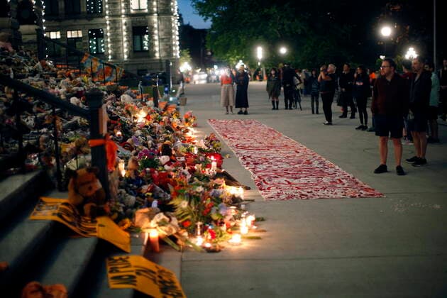 July 1, 2021, Victoria, BC, Canada: People pay respects to the victims of Canada s residential school system amid shoes, teddy bears, orange shirts and other tributes placed on the steps outside the legislature, in Victoria, Thursday, July 1, 2021. Victoria Canada  - ZUMAc35_ 20210701_zaf_c35_304 Copyright: xChadxHipolitox