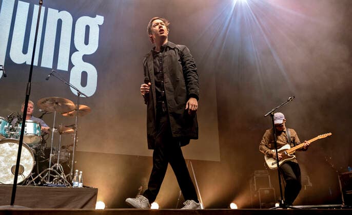 The Danish band Jung with Jonas Jung in front plays up to Havefest paa Plaenen in Tivoli on Friday 2 July 2021 with the audience divided into two sections Havefest replaces Fredagsrock, which has been canceled due to Covid 19 Corona crisis Photo Torben Christensen @ Copenhagen, Copenhagen  Copyright: TorbenxChristensen TorbenxChristensenx COP106 spdk20210703-010248-L