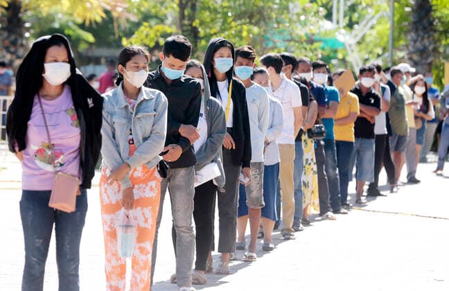 (210703) -- PHNOM PENH, July 3, 2021 -- People line up for COVID-19 vaccines at an inoculation site in Phnom Penh, Cambodia on July 2, 2021. (Photo by Xinhua) CAMBODIA-PHNOM PENH-COVID-19-VACCINATION Phearum 