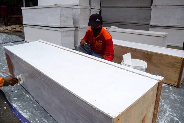 Coffins for Covid-19 Victims Workers paint coffins in Surabaya City, East Java Province, Indonesia, Saturday 3 July 2021. The Surabaya City Government produces hundreds of coffins to anticipate the increasing number of people who have died from Covid-19. In general, the number of people infected with Covid-19 in Indonesia has increased again. Currently, the number of cases reached 2.3 million people who were infected, 1.9 million people were declared cured, and 59,534 people died.  Copyright: xPatrikxCahyoxLumintux xOpnxImagex