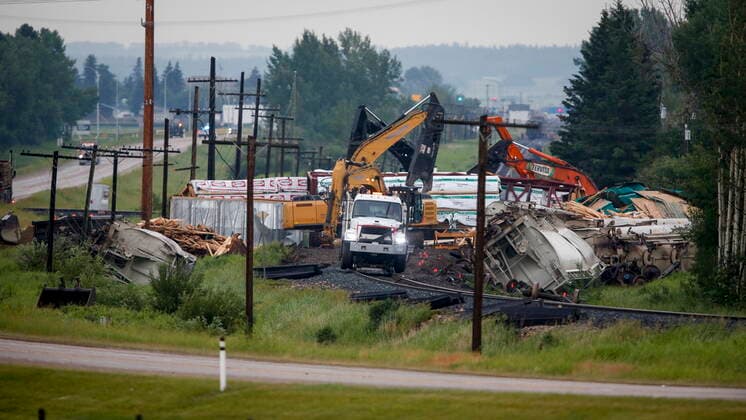 July 3, 2021, Blackfalds, ab, Canada: Crews work to clean up a spill after the derailment of a 20-car train carrying tar sand and lumber near Blackfalds, Alta., Saturday, July 3, 2021. Blackfalds Canada  - ZUMAc35_ 20210703_zaf_c35_001 Copyright: xJeffxMcintoshx