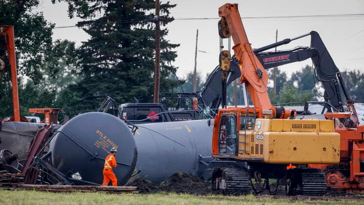 July 3, 2021, Blackfalds, ab, Canada: Crews work to clean up a spill after the derailment of a 20-car train carrying tar sand and lumber near Blackfalds, Alta., Saturday, July 3, 2021. Blackfalds Canada  - ZUMAc35_ 20210703_zaf_c35_002 Copyright: xJeffxMcintoshx