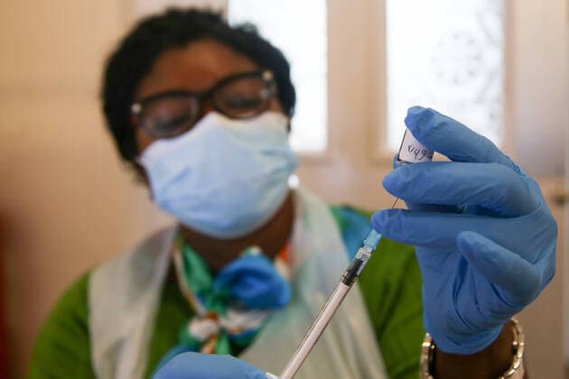 July 3, 2021, London, United Kingdom: A NHS health worker prepares to administer Pfizer BioNTech Covid-19 vaccine to a member of public at a vaccination centre in London. London United Kingdom - ZUMAs197 20210703_zaa_s197_065 Copyright: xDinendraxHariax