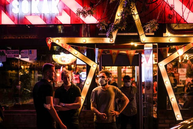 July 3, 2021, Ankara, Turkey: People chatting after midnight in front of a bar..President of the Republic of Turkey, Recep Tayyip Erdogan, announced his decision to normalize after the cabinet meeting he held on June 21. As of July 1, while the weekend curfew was lifted in Turkey, many restrictions were lifted due to the decrease in COVID-19 cases, and then normal life was returned. Ankara Turkey - ZUMAs197 20210703_zaa_s197_349 Copyright: xTunahanxTurhanx