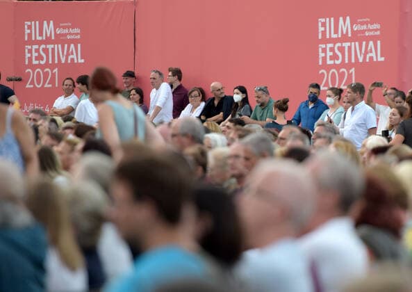 (210703) -- VIENNA, July 3, 2021 -- People watch the opening concert of the Cultural Summer Vienna and Rathausplatz Film Festival in Rathausplatz in Vienna, Austria, on July 3, 2021. Rathausplatz Film Festival held from July 3 to Sept. 4 opened here on Saturday. People can get access to the event free under the 3G rules, which are showing evidence of vaccination, a negative test or having recently recovered from the coronavirus. Meanwhile, a COVID-19 vaccination site has been set up here to provide walk-in COVID-19 vaccination for visitors during the film festival. ) AUSTRIA-VIENNA-RATHAUSPLATZ FILM FESTIVAL-COVID-19 VACCINATION GuoxChen 