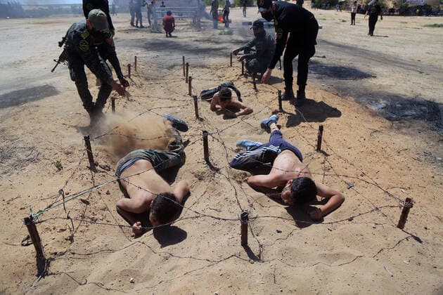 July 4, 2021, Gaza city, Gaza Strip, Palestinian Territory: Young Palestinians take part in a military summer camp organised by the Islamic Jihad Movement, in Gaza City on July 04, 2021 Gaza city Palestinian Territory - ZUMAap3_ 20210704_zaf_ap3_114 Copyright: xDawoudxAboxAlkasx