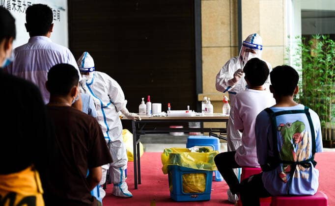 (210705) -- RUILI, July 5, 2021 -- Medical workers conduct nucleic acid test in Ruili City of southwest China s Yunnan Province, on July 5, 2021. Ruili City on Monday imposed entry and exit restrictions after the emergence of new COVID-19 cases. The city reported three new locally transmitted confirmed COVID-19 cases on Sunday. Authorities have asked people to refrain from entering or leaving the city unless necessary. ) CHINA-YUNNAN-RUILI-COVID-19-TEST (CN) WangxGuansen 