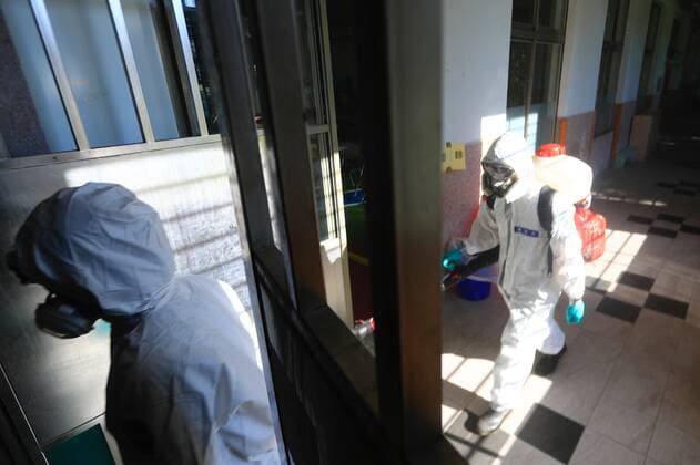 July 5, 2021, Taipei, Taipei, Taiwan: Chemical troop officers with personal protective equipment disinfect a vaccination centre in Taipei, as the island is combating an outbreak with a increasing number of infections and deaths of Covid-19. The island has previously reported cases of Covid delta variant while facing shortage of vaccines that a nationwide level 3 Covid-19 alert has been extended. Taipei Taiwan - ZUMAs313 20210705_zip_s313_020 Copyright: xDanielxCengxShou-Yix