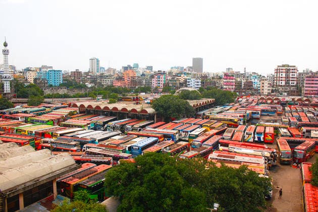 Bangladesh: Buses are not able to run on the road Due to the strict lockdown, no buses are able to run on inter-district routes. In this meantime bus worker s are passing their time by playing card and taking rest in Dhaka. Dhaka Bangladesh Saidabad Bus Stand Copyright: MdxIbrahim