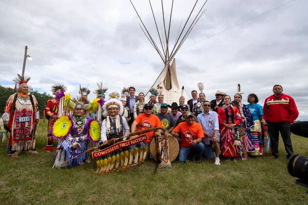 July 6, 2021, Cowessess First Nation, SK, Canada: Prime Minister Justin Trudeau, Chief Cadmus Delorme, Saskatchewan Premier Scott Moe stand for a large group photo following a signing ceremony as part of a transfer of control over children in care to the community, in Cowessess First Nation, Sask., Tuesday, July 6, 2021. Cowessess is also the site of a former residential school where, last month, ground-penetrating radar detected a potential 751 unmarked graves. Cowessess First Nation Canada - ZUMAc35_ 20210706_zaf_c35_081 Copyright: xLiamxRichardsx