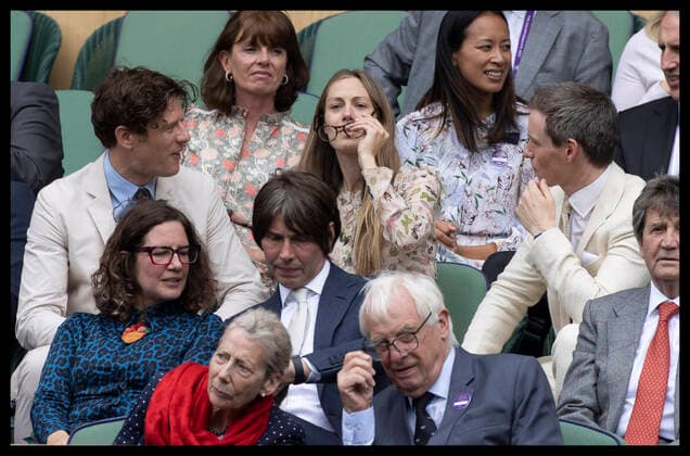 . 07 07 2021. London, United Kingdom. James Norton lends his glasses to Hannah Redmayne with husband Eddie Redmayne (right) in the Royal Box on day nine of the Wimbledon Tennis Championships in London.  xStephenxLockx xi-Imagesx IIM-22370-0094