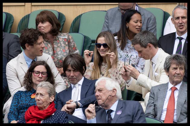 . 07 07 2021. London, United Kingdom. James Norton lends his glasses to Hannah Redmayne with husband Eddie Redmayne (right) in the Royal Box on day nine of the Wimbledon Tennis Championships in London.  xStephenxLockx xi-Imagesx IIM-22370-0098