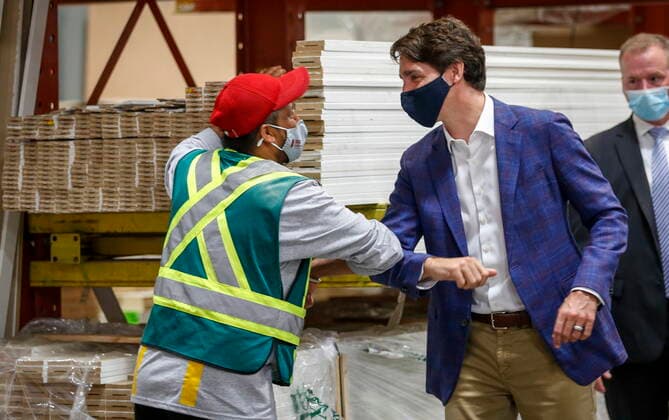 July 7, 2021, Calgary, ab, Canada: Prime Minister Justin Trudeau elbow bumps an employee as he tours the AAA Door company in Calgary, Alta., Wednesday, July 7, 2021. Calgary Canada  - ZUMAc35_ 20210707_zaf_c35_002 Copyright: xJeffxMcintoshx