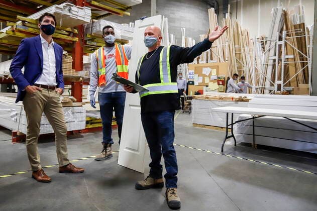 July 7, 2021, Calgary, ab, Canada: Prime Minister Justin Trudeau, left, tours the AAA Door company in Calgary, Alta., Wednesday, July 7, 2021. Calgary Canada - ZUMAc35_ 20210707_zaf_c35_004 Copyright: xJeffxMcintoshx