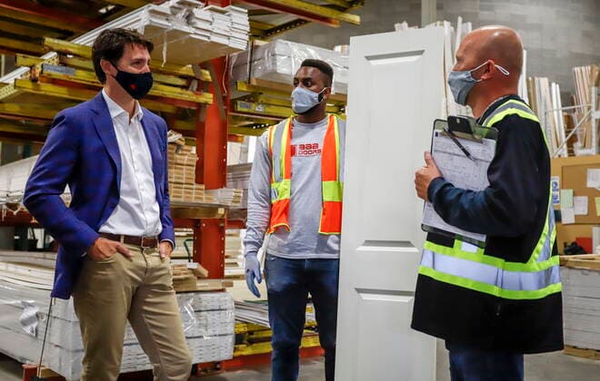 July 7, 2021, Calgary, ab, Canada: Prime Minister Justin Trudeau, left, tours the AAA Door company in Calgary, Alta., Wednesday, July 7, 2021. Calgary Canada - ZUMAc35_ 20210707_zaf_c35_005 Copyright: xJeffxMcintoshx
