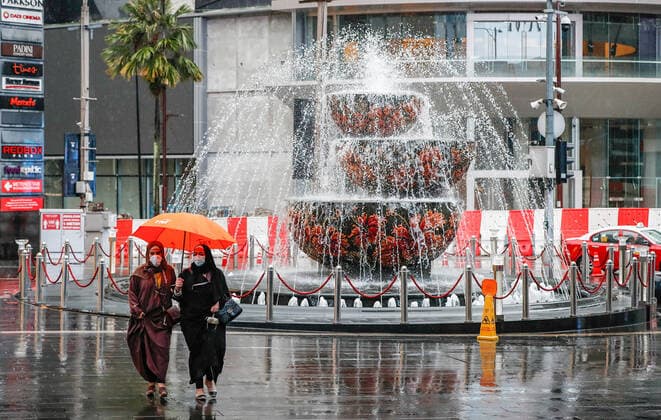 July 8, 2021, Kuala Lumpur, Malaysia: Pedestrians with an umbrella walking along a deserted street during heavy downpour in downtown. Kuala Lumpur Malaysia - ZUMAs197 20210708_zaa_s197_066 Copyright: xWongxFokxLoyx