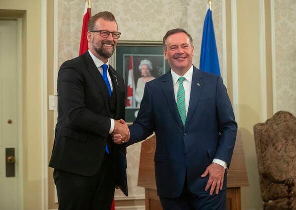 July 8, 2021, EDMONTON, ab, Canada: Newly-appointed Associate Minister of Mental Health and Addictions Mike Ellis shakes hands with Alberta Premier Jason Kenney during a cabinet shuffle a Government House in Edmonton on Thursday, July 8, 2021. EDMONTON Canada  - ZUMAc35_ 20210708_zaf_c35_030 Copyright: xJasonxFransonx