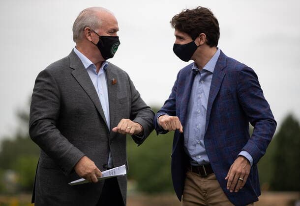 July 8, 2021, Coquitlam, BC, Canada: B.C. Premier John Horgan, left, and Prime Minister Justin Trudeau bump elbows during an announcement and news conference at Lafarge Lake Park, in Coquitlam, B.C., on Thursday, July 8, 2021. Coquitlam Canada - ZUMAc35_ 20210708_zaf_c35_040 Copyright: xDarrylxDyckx
