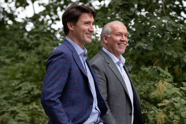 July 8, 2021, Coquitlam, BC, Canada: Prime Minister Justin Trudeau, front left, and B.C. Premier John Horgan arrive for an announcement and news conference at Lafarge Lake Park, in Coquitlam, B.C., on Thursday, July 8, 2021. Coquitlam Canada - ZUMAc35_ 20210708_zaf_c35_045 Copyright: xDarrylxDyckx