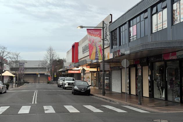 NSW POLICE COVID19 COMPLIANCE, An empty street in the shopping district is seen in the southwestern suburb of Fairfield in Sydney, Friday, July 9, 2021. At least 100 more police will be deployed to southwest Sydney from Friday in a high-visibility operation to ensure compliance with public health orders. ( NO ARCHIVING, EDITORIAL USE ONLY, NO USE IN BOOKS WITHOUT CONSENT SYDNEY NSW AUSTRALIA  Copyright: xMICKxTSIKASx 20210709001555891990