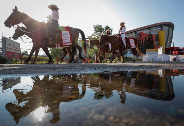 July 9, 2021, Calgary, ab, Canada: Stampede princesses ride past the Saddledome during the Calgary Stampede parade in Calgary, Alta., Friday, July 9, 2021. Calgary Canada  - ZUMAc35_ 20210709_zaf_c35_018 Copyright: xJeffxMcintoshx