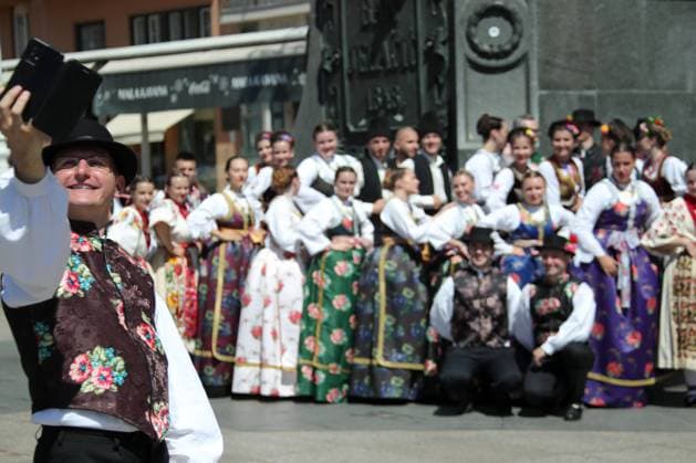 PXL_INTERNATIONAL FOLKLORE FESTIVAL The Serbian and Macedonian flags were also flown in the center of the Zagreb city on 9. July, 2021. Although the International Folklore Festival takes place in town of Velika Gorica, many participants decided to stop by the capital Zagreb center and thus enjoy the sights of the city and take home the most beautiful memories with a few photos. SanjinxStrukic PIXSELL