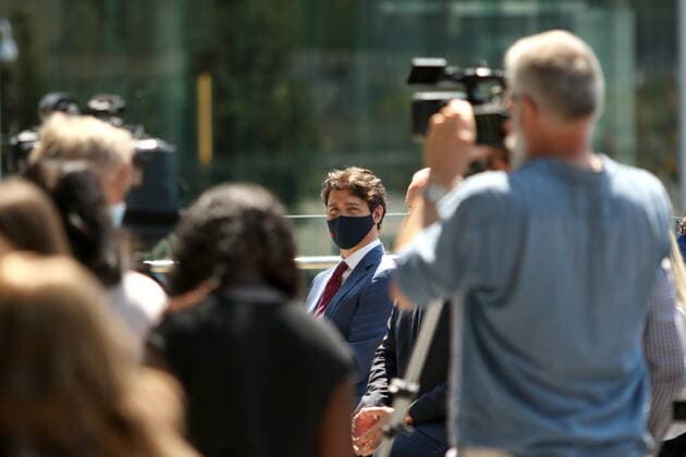 July 9, 2021, Surrey, BC, Canada: Prime Minister Justin Trudeau looks on following his transit announcement during a press conference at Surrey City Hall in Surrey, B.C., on Friday, July 9, 2021 as police and protestors gather below. Surrey Canada  - ZUMAc35_ 20210709_zaf_c35_053 Copyright: xChadxHipolitox