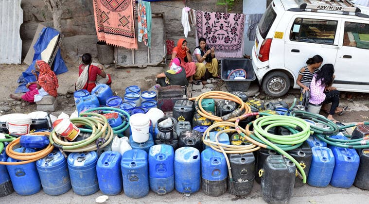 NEW DELHI, INDIA ? JULY 10: People gather to collect drinking water from a tanker in Sanjay camp, Chanakyapuri, on July 10, 2021 in New Delhi, India. The Aam Aadmi Party MLA said Haryana has been supplying about 100 million gallons less water per day, which has led to water crisis in NDMC areas, central, south, and west Delhi. (Photo by Sonu Mehta Hindustan Times ) Water Crisis In Delhi