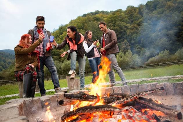 Group of people standing around campfire.  Copyright: xShyxAlxBritanni arabianEyex AP49137