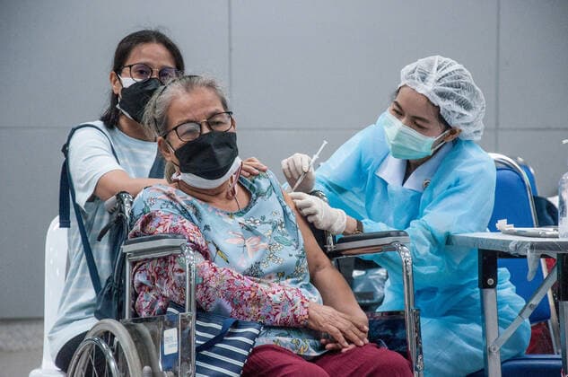 July 11, 2021, Bangkok, Thailand: A health worker administers a dose of AstraZeneca vaccine to an elderly woman during a vaccination against COVID-19 at Bang Sue Grand Station in Bangkok. .Thailand has a record high of 86 new Covid-19 fatalities and 9,539 new cases over the past 24 hours, the Public Health Ministry reported. Bangkok Thailand - ZUMAs197 20210711_zaa_s197_086 Copyright: xPeeraponxBoonyakiatx