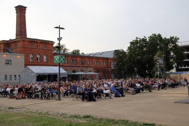 Audience at the concert of Alexander Scheer, Andreas Dresen and band at Waschhaus in Potsdam, 11 July 2021 Waschhaus Open Air