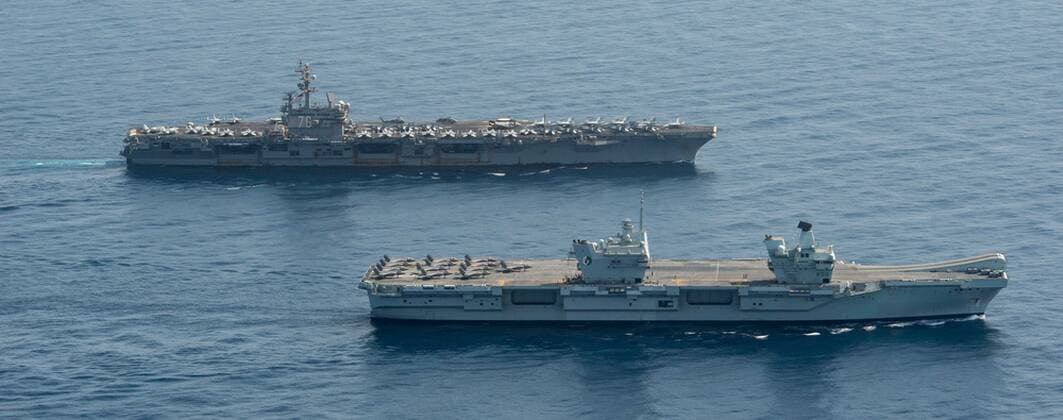 GULF OF ADEN (July 12, 2021) Royal Navy aircraft carrier HMS Queen Elizabeth ( R 08), front, and aircraft carrier USS Ronald Reagan (CVN 76) operate in formation in the Gulf of Aden, July 12. UK, Dutch and U.S. naval forces conducted an integrated at-sea exercise designed to enhance maritime interoperability and demonstrate naval integration through a series of training scenarios. ( ) Where: Gulf of Aden When: 12 Jul 2021 Credit: US Navy Cover-Images.com **Editorial Use Only** Copyright: xx 41582256 EDITORIAL USE ONLY. NOT FOR USE BY NEWSPAPERS BASED IN THE UK.