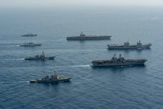 GULF OF ADEN (July 12, 2021) Ships of the UK Carrier Strike Group, USS Ronald Reagan Carrier Strike Group, and Iwo Jima Amphibious Ready Group operate in formation in the Gulf of Aden, July 12. UK, Dutch and U.S. naval forces conducted an integrated at-sea exercise designed to enhance maritime interoperability and demonstrate naval integration through a series of training scenarios. ( ) Where: Gulf of Aden When: 12 Jul 2021 Credit: US Navy Cover-Images.com **Editorial Use Only** Copyright: xx 41582257 EDITORIAL USE ONLY. NOT FOR USE BY NEWSPAPERS BASED IN THE UK.