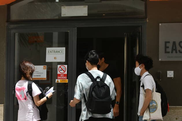(210713) -- ST JULIAN S, July 13, 2021 -- Students are seen outside an English language school in St Julian s, Malta, on July 13, 2021. Starting from July 14, Malta will once again close its English language teaching schools after most of the new cases were students who traveled to Malta to learn English. (Photo by Xinhua) MALTA-ST JULIAN S-COVID-19-MEASURES JonathanxBorg 