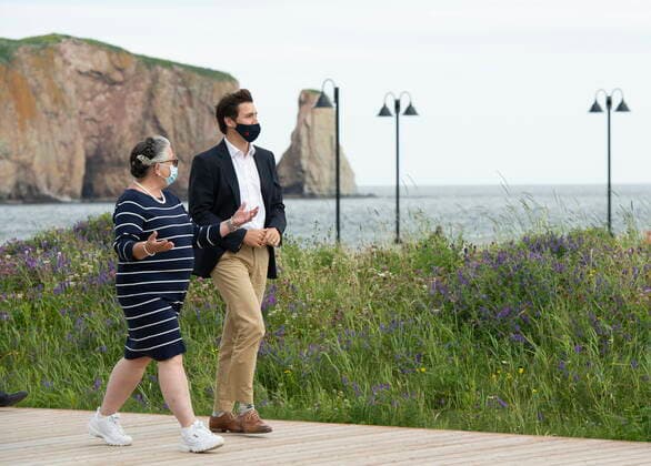 July 14, 2021, PERCE, PQ, Canada: Prime Minister Justin Trudeau and Minister of National Revenue Diane Lebouthillier take a stroll on the boardwalk near the Perce rock, following a meeting on Wednesday, July 14, 2021 in Perce Quebec. PERCE Canada  - ZUMAc35_ 20210714_zaf_c35_002 Copyright: xJacquesxBoissinotx