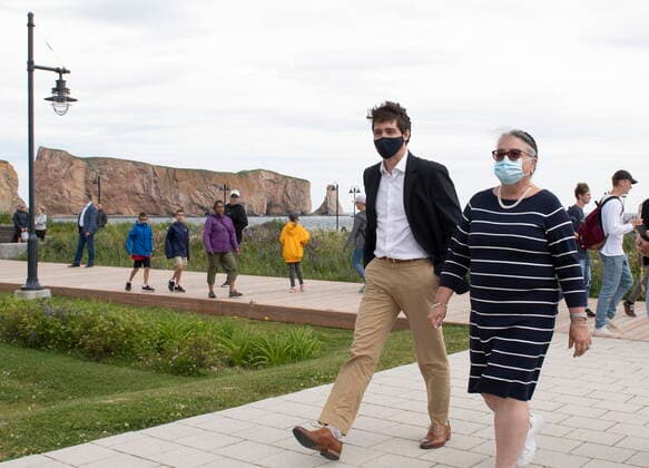 July 14, 2021, PERCE, PQ, Canada: Prime Minister Justin Trudeau and Minister of National Revenue Diane Lebouthillier take a stroll on the boardwalk near the Perce rock, following a meeting on Wednesday, July 14, 2021 in Perce, Quebec. PERCE Canada  - ZUMAc35_ 20210714_zaf_c35_004 Copyright: xJacquesxBoissinotx