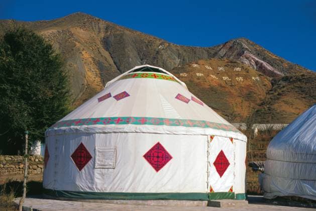 The word yurt is originally from a Turkic word referring to the imprint left in the ground by a moved yurt, and by extension, sometimes a person s homeland, kinsmen, or feudal appanage. The term came to be used in reference to the physical tent-like dwellings only in other languages.<br ><br > The Kazakhs (also Kazaks) are a Turkic people of the northern parts of Central Asia (largely Kazakhstan, but also found in parts of Uzbekistan, China, Russia, and Mongolia). China: Kazakh yurt near Tian Chi (Heaven Lake) in the Tian Shan (Heavenly Mountains), Xinjiang Province xCPAxMediaxCo.xLtd.x Copyright: xDavidxHenleyx