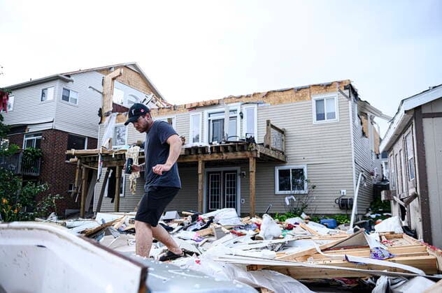 July 15, 2021, Barrie, on, Canada: A resident surveys the damage left after a tornado touched down in his neighbourhood, in Barrie, Ont., on Thursday, July 15, 2021. Barrie Canada  - ZUMAc35_ 20210715_zaf_c35_087 Copyright: xChristopherxKatsarovx