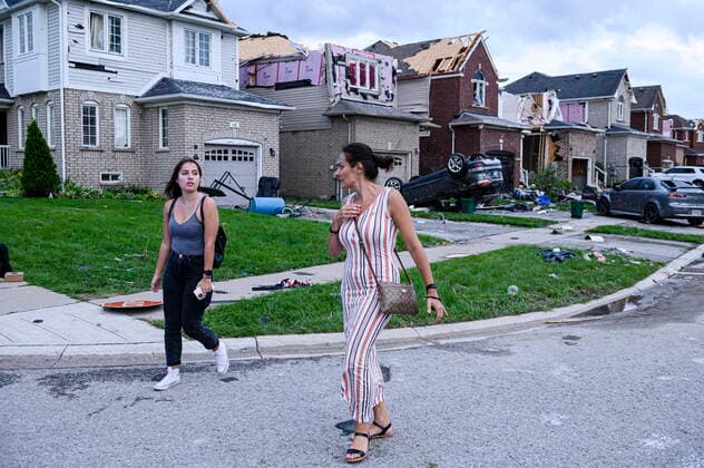 July 15, 2021, Barrie, on, Canada: Residents leave their homes after a tornado caused significant damage, in Barrie, Ont., on Thursday, July 15, 2021. Barrie Canada  - ZUMAc35_ 20210715_zaf_c35_104 Copyright: xChristopherxKatsarovx